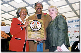 Yvonne B. Burke, Supervisor; Robert Townsend, Honoree; Margaret Donnellan Todd, County Librarian