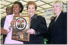 Yvonne B. Burke, Supervisor; Etta James, Honoree; Margaret Donnellan Todd, County Librarian